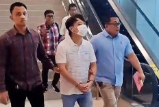 Tampang Ivan Sugianto Usai Ditangkap di Bandara Juanda: Tangan Diborgol, Wajah Ditutup Masker